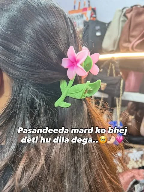 Pink lily claw clip in a girl's hair